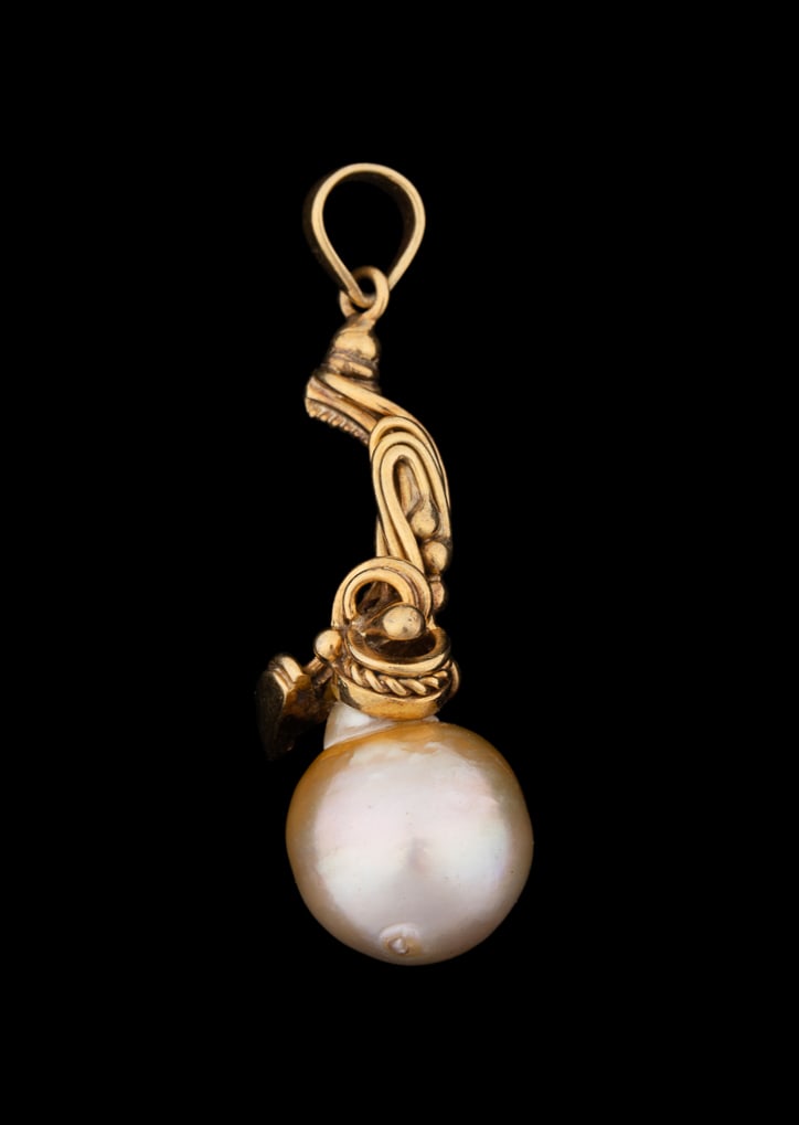 CULTURED GOLDEN PEARL & 18K YELLOW GOLD PENDANT: Golden pearl teardrop shape pendant with golden cultured pearl measuring approximately 18.0mm, suspended from intricately swirled and rope twist 18K yellow gold mount. Marked '"18K". Provenance: