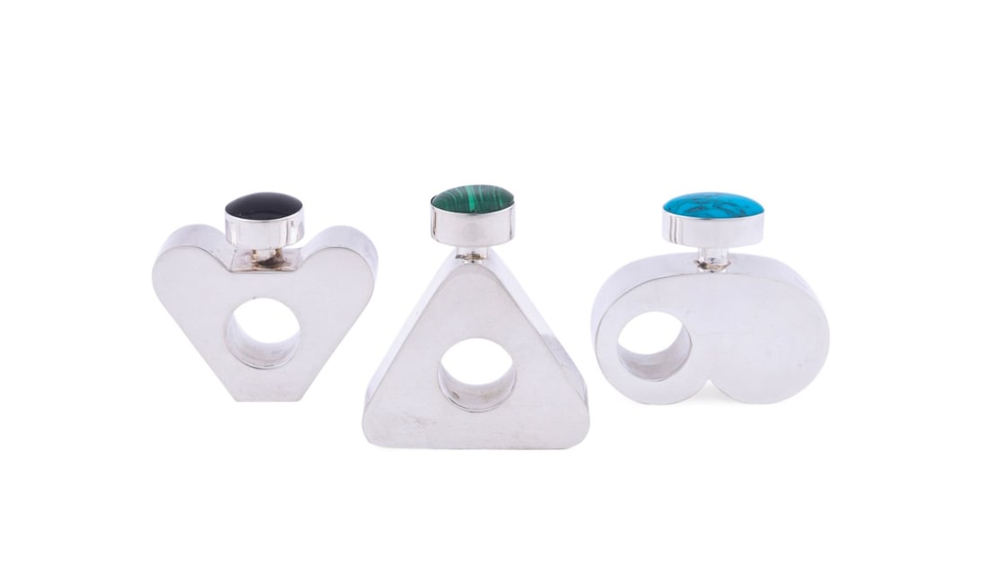 THREE MODERNIST DIMINUTIVE STERLING SCENT BOTTLES: Mexican, second quarter 20th century. Set of the Taxco sterling silver Modernist diminutive geometric scent or perfume bottles, the lids set with semiprecious stones, malachite, onyx, and turquoise, a