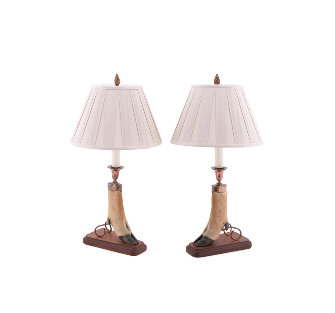 PR. OF WHITE TAIL DEER FEET MOUNTED AS LAMPS, 1910: Likely Canadian, 1910. Pair of taxidermy deer feet, mounted as candlesticks, and now converted to lamps, having previously plated mounts, now with exposed copper and base metals, and each engraved "'W