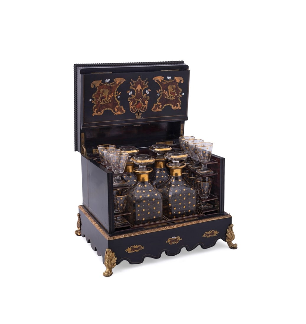 NAPOLEON III BOULLE INLAID EBONIZED CAVE A LIQUEUR: French, second half 19th century. Napoleon III ebonized boulle work cave a liqueur, having brass, burl, faux shell, and mother-of-pearl inlay, lift-top and swing-out sides with storage to the base, fo