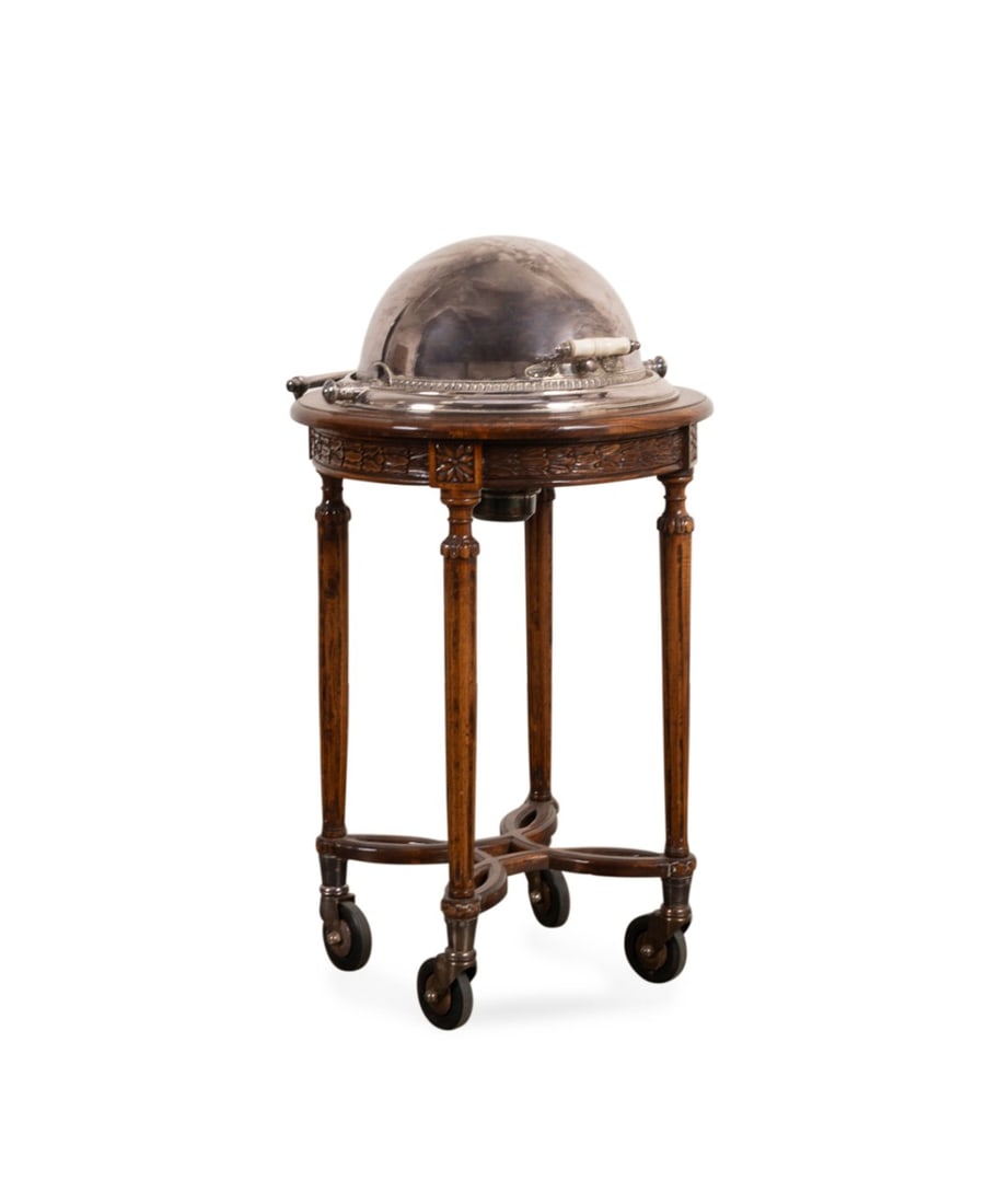 LOUIS XVI REVIVAL SILVERPLATE CARVING TROLLEY: Royal Castle (English, active last quarter 20th century), late 20th century. Silverplate and oak rolling restaurant meat carving station, having a roll-top top, wooden cutting board above a hot water