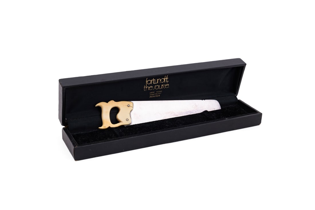 VICTORIAN SILVERPLATE & BONE CUCUMBER SAW, C. 1870: Thomas Harwood & Sons (English (Sheffield), active 1864-1896), late 19th century. Victorian novelty silverplate and bone cucumber saw, in an associated Fortunoff box, appropriately marked.