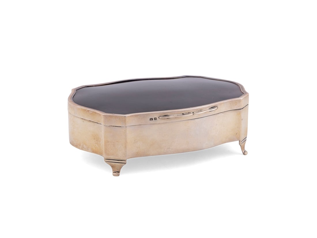 HENRY MATHEWS, 1928 SHELL & STERLING DRESSER BOX: Henry Mathews (English (Birmingham), reg. 1894-1930), 1928. Cartouche form sterling silver and shell mounted dresser box, stamped maker's mark "H M", city mark, sterling fineness and "D" date mark to