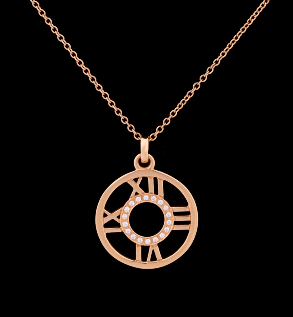 TIFFANY & CO., ATLAS OPEN GOLD & DIAMOND NECKLACE: Tiffany & Co. Pink gold Atlas Open pendant and chain featuring (18) round brilliant cut diamonds weighing approximately 0.16 total carats (VVS-2 clarity, E color). Set in 18K pink gold with spring rin