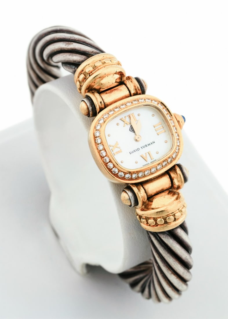DAVID YURMAN, DIAMOND ACCENT BANGLE WRIST WATCH: David Yurman. Diamond, 18k yellow gold, and sterling silver cable bangle wrist watch featuring (36) round brilliant cut diamonds weighing approximately 0.36 total carats (VS-2 clarity, G/H color) on b