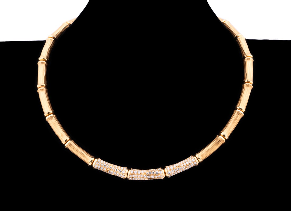 CARTIER 18K GOLD & DIAMOND BAMBOO MOTIF NECKLACE: Cartier. 18k gold bamboo motif links with approximately (180) round brilliant cut diamonds weighing approximately 5.40 total carats (VVS-2 clarity, F color) set in three center links. Marked "Cartier