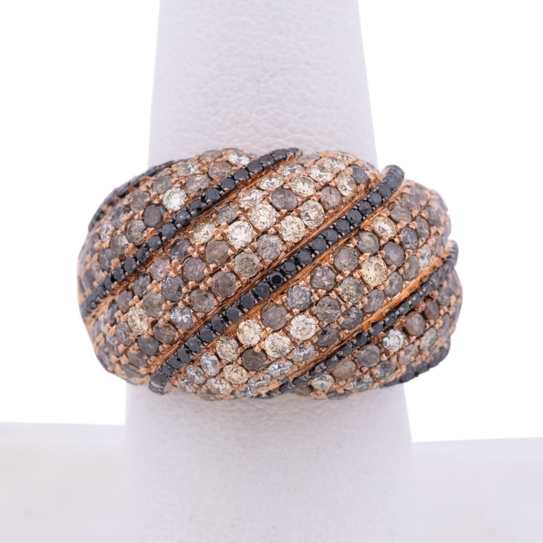 DIAMOND CLUSTER 18K ROSE GOLD DOME RING: Diamond cluster ring featuring approximately (380) round brilliant cut diamonds weighing approximately 5.25 total carats (overall I-2/I-3 clarity and black/white/yellow/brown color), bead prong set at