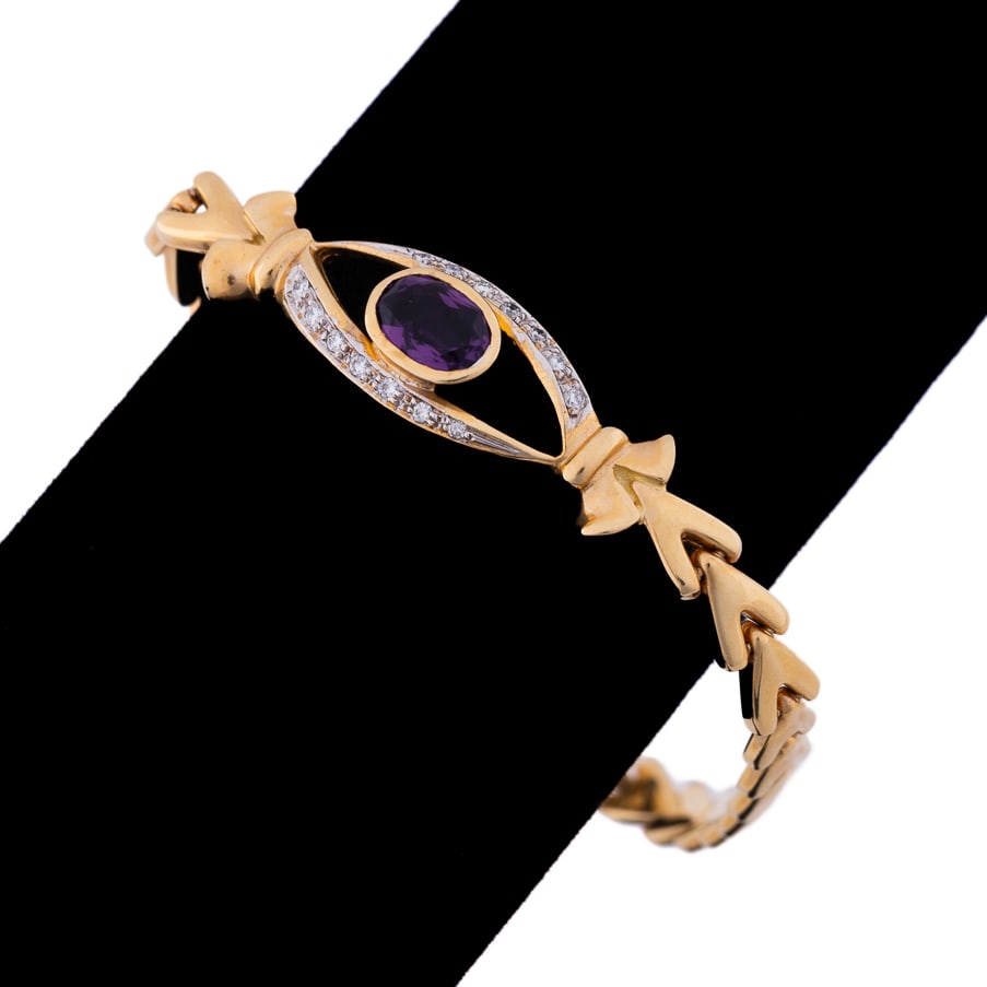 AMETHYST AND DIAMOND BRACELET, SET IN 14K YG: Italian amethyst and diamond bracelet featuring (1) oval shape purple amethyst weighing approximately 1.00 total carat accented by (14) round brilliant cut diamonds weighing approximately 0.25 total c