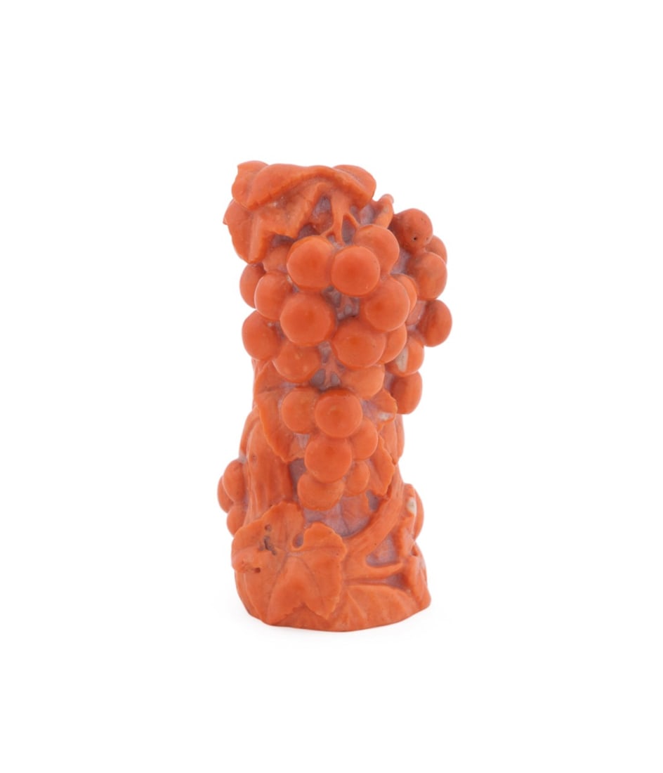 CHINESE CARVED CORAL SCULPTURE OF GRAPES: Chinese. Carved coral sculpture modeled as a bunch of grapes, signed near the base and numbered 103 or 123.