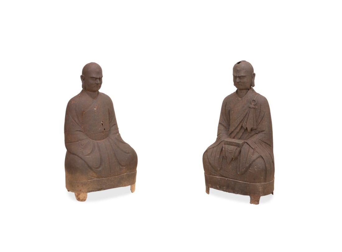 CHINESE, PAIR OF CAST-IRON SEATED LOHAN FIGURES: Chinese. Pair of cast iron seated luohan (monks) figures, having cast stern contemplative expressions and both wrapped in priest's robes, cast illegible year, temple location, and inscription to lower