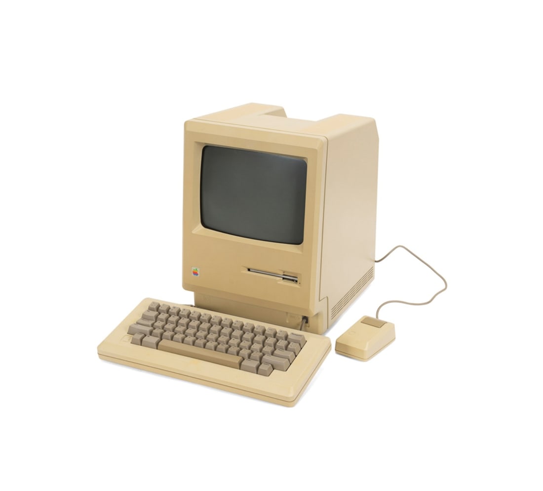 APPLE MACINTOSH M0001 WITH ACCESSORIES: Apple Inc. (American, founded 1976), first produced in 1984. Apple Macintosh M0001 personal computer, comprising a computer with built in monitor, original mouse, keyboard with cord, two period softwa