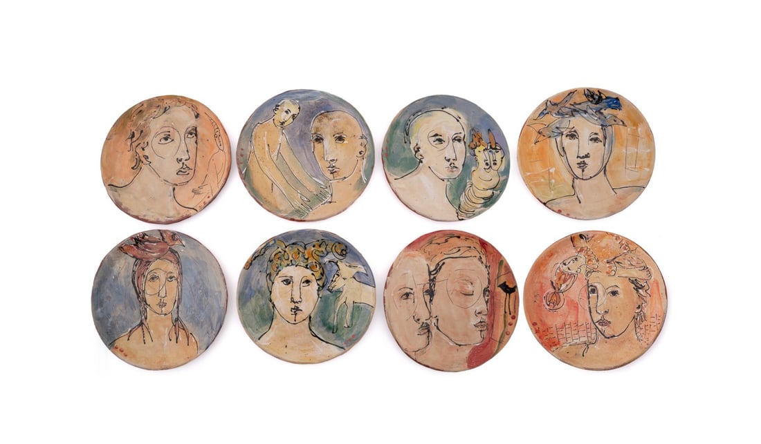 DEBRA FRITTS, 8 GLAZED POTTERY PORTRAIT PLATES: Debra W. Fritts (American, born 1953), 2011. Collection of eight whimsical, individually designed bust portrait glazed pottery chargers, each signed "D. Fritts" to the back. Provenance: Private Collec