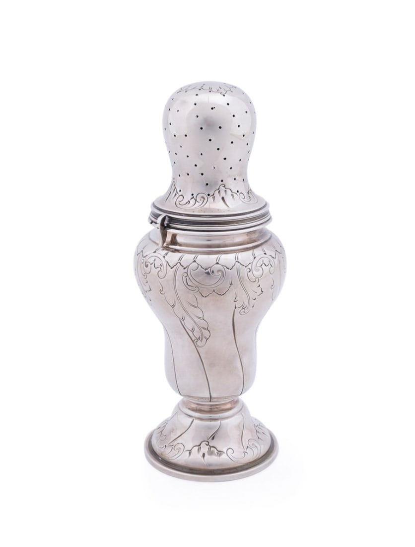 BUCCELLATI ROCOCO STYLE STERLING SUGAR CASTER: Buccellati (Italian, founded 1919), 20th century. Sterling sugar caster or muffineer in the Rococo taste, having chased decoration, appropriately marked. Approximate dimensions: h. 10", dia. 4"; total