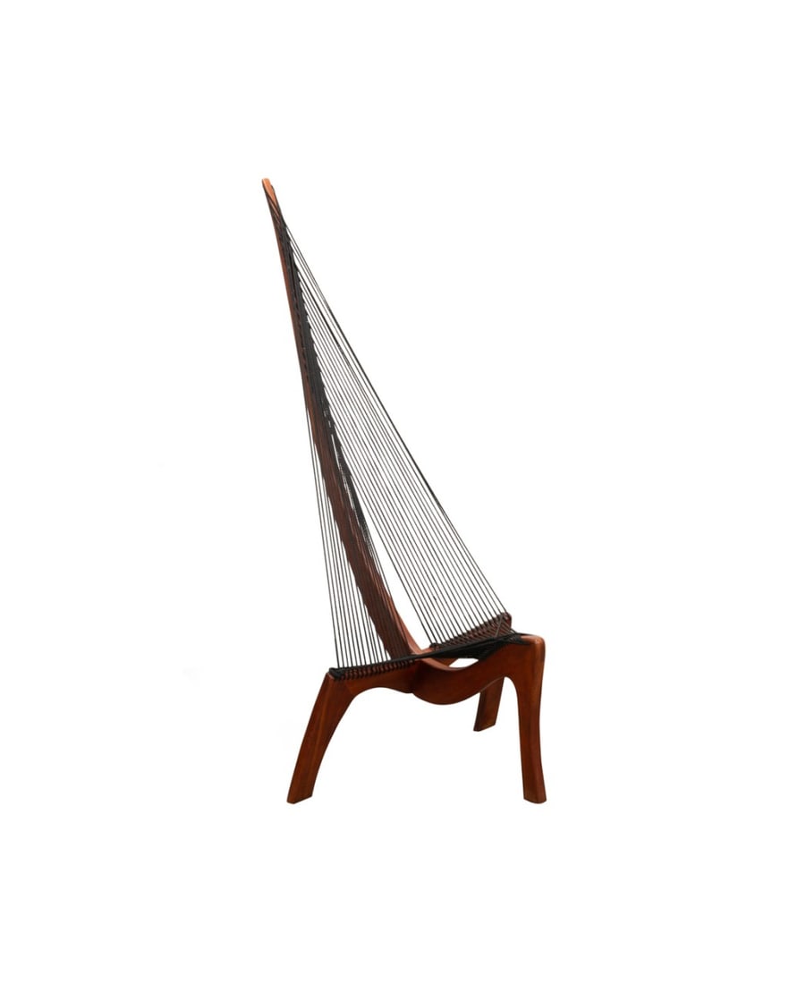 TEAK 'HARP' CHAIR, MANNER OF JORGEN HOVELSKOV: Style of Jorgen Hovelskov (Danish, 1935-2005). Sculptural "Harp" chair, in teak with woven rope, apparently unmarked. Approximate dimensions: h. 67", w. 29.75", d. 34.5"