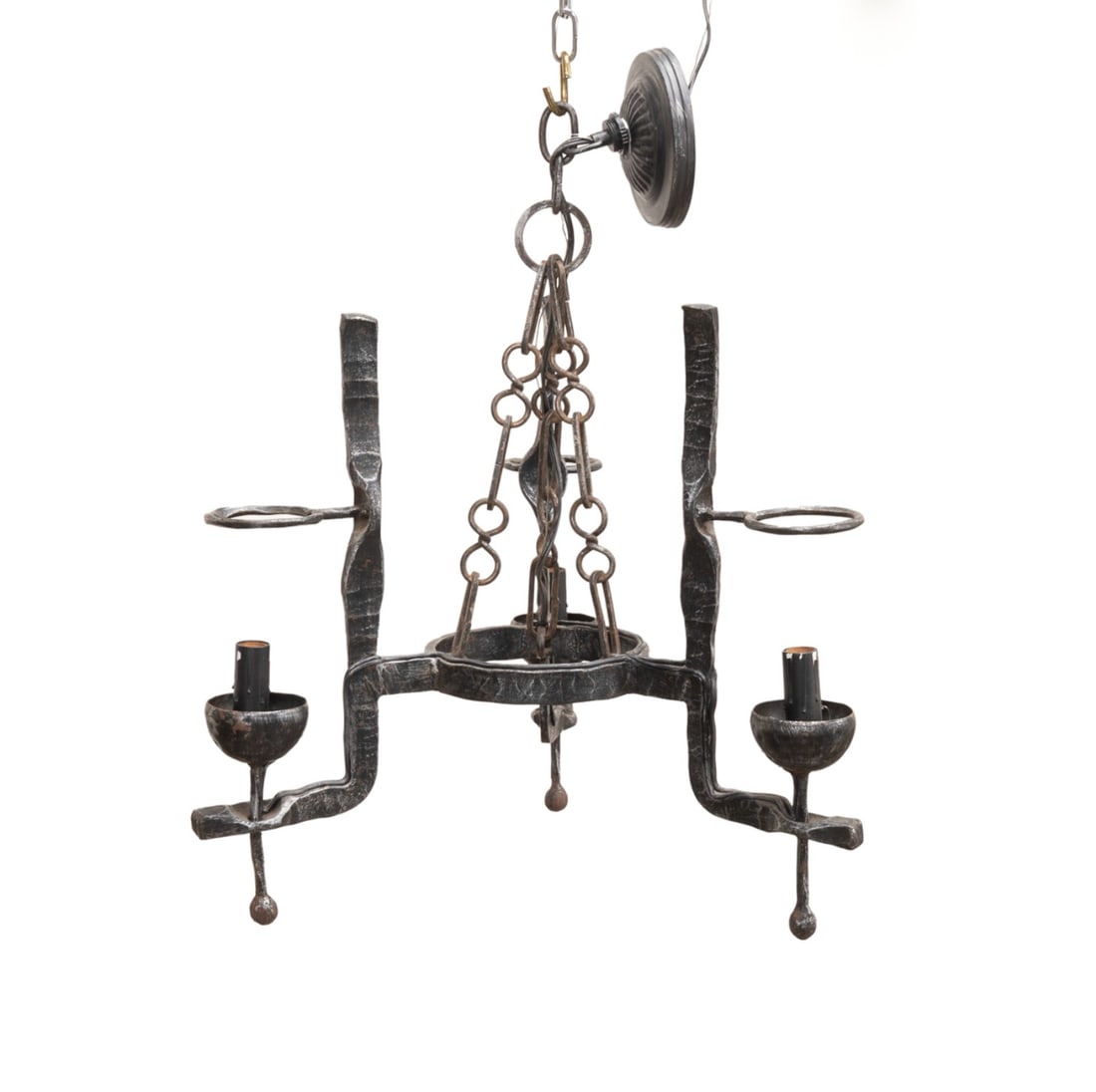 CONTINENTAL BRUTALIST WROUGHT IRON CHANDELIER: Continental, probably French, mid 20th century. Brutalist modern hand hammered wrought iron 3-light chandelier with circular canopy issuing three chains joined to the circlet continuing to three elong
