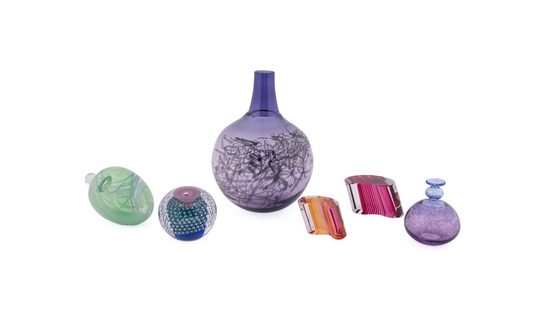KOSTA BODA, SIX PCS ART GLASS OBJECTS INCL. VASE: Kosta Boda (Swedish, founded 1742), late 20th to early 21st century. Assortment of six colorful art glass works comprising one "Scribble" vase designed by Gunnel Sahlin (Swedish, born 1954), one clear