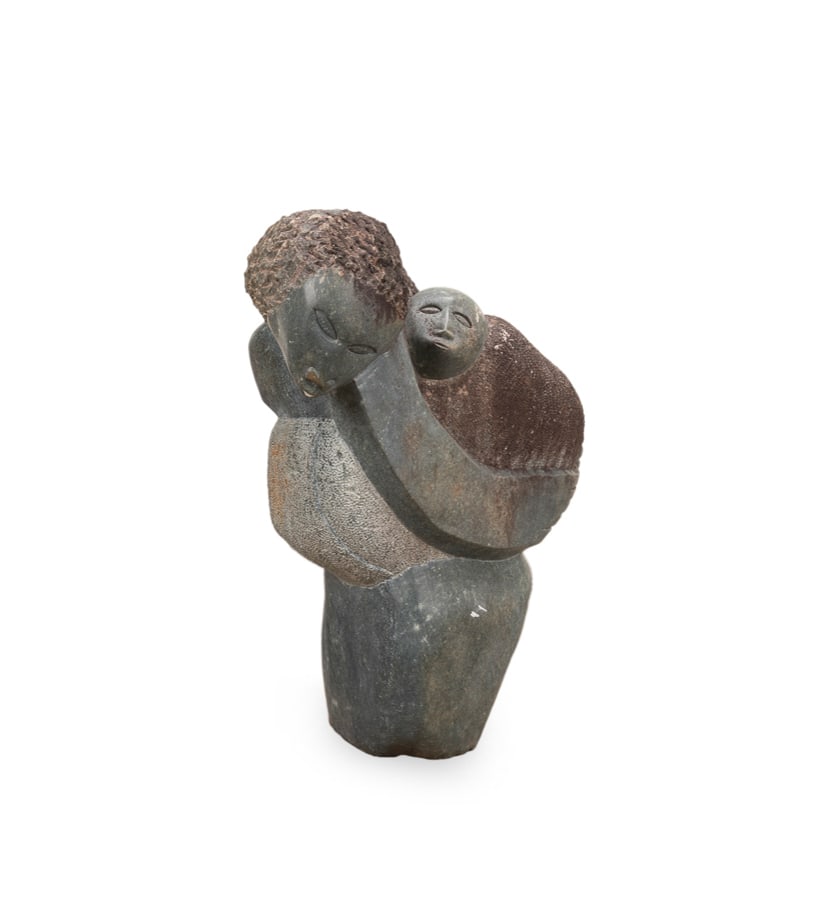 AFRICAN LARGE FIGURAL SHONA GRAY STONE SCULPTURE: African school, 20th century, "Mother and Child" depicting a mother with long flowing hair holding her child, the carved gray stone sculpture with various textures, apparently unsigned. Provenance: