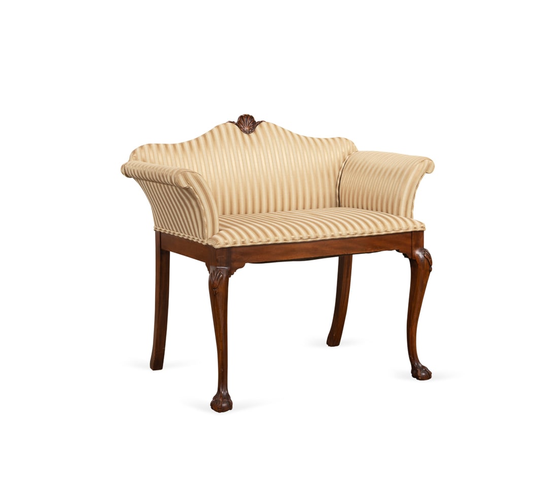 George III Upholstered Window Seat, 20th: George III Style Upholstered Window Seat 20th Century, English or American having a carved shell crest, yellow striped fabric, padded arms and carved legs, apparently unmarked. 29 3/4 x 32 3/4 x 19 1/