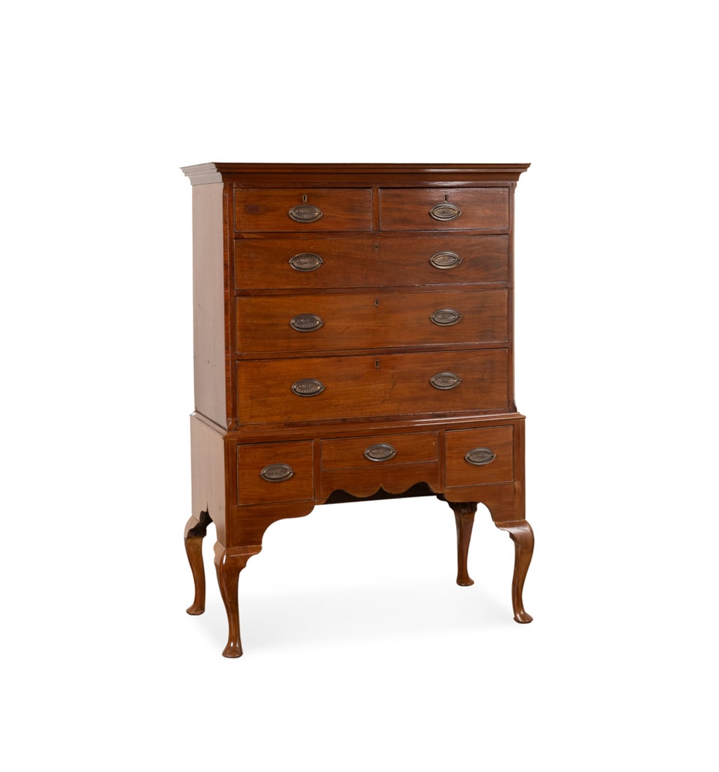 Queen Anne Mahogany Highboy, 19th Century: Queen Anne Style Mahogany Highboy 19th Century, English having a shaped cornice, eight cock beaded drawers, and brass oval pulls, apparently unmarked. 67 3/8 x 47 1/4 x 23 3/4 in. (171.1 x 120 x 60.3 