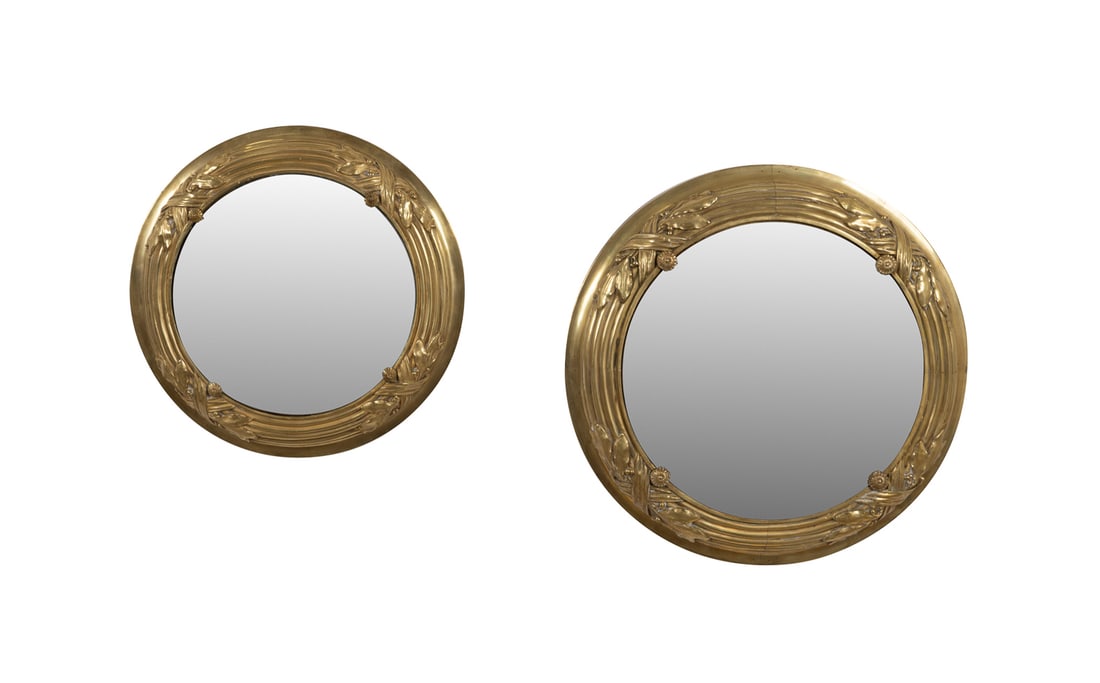 Two Neoclassical Gilt Bronze Mirrors: Two Neoclassical Style Gilt Bronze Mirrors, Retailed by Nesle 20th Century, American Retailed by Nesle, Inc. (American, founded 1936). Two graduated circular gilt bronze mirrors in the Neoclassical ta