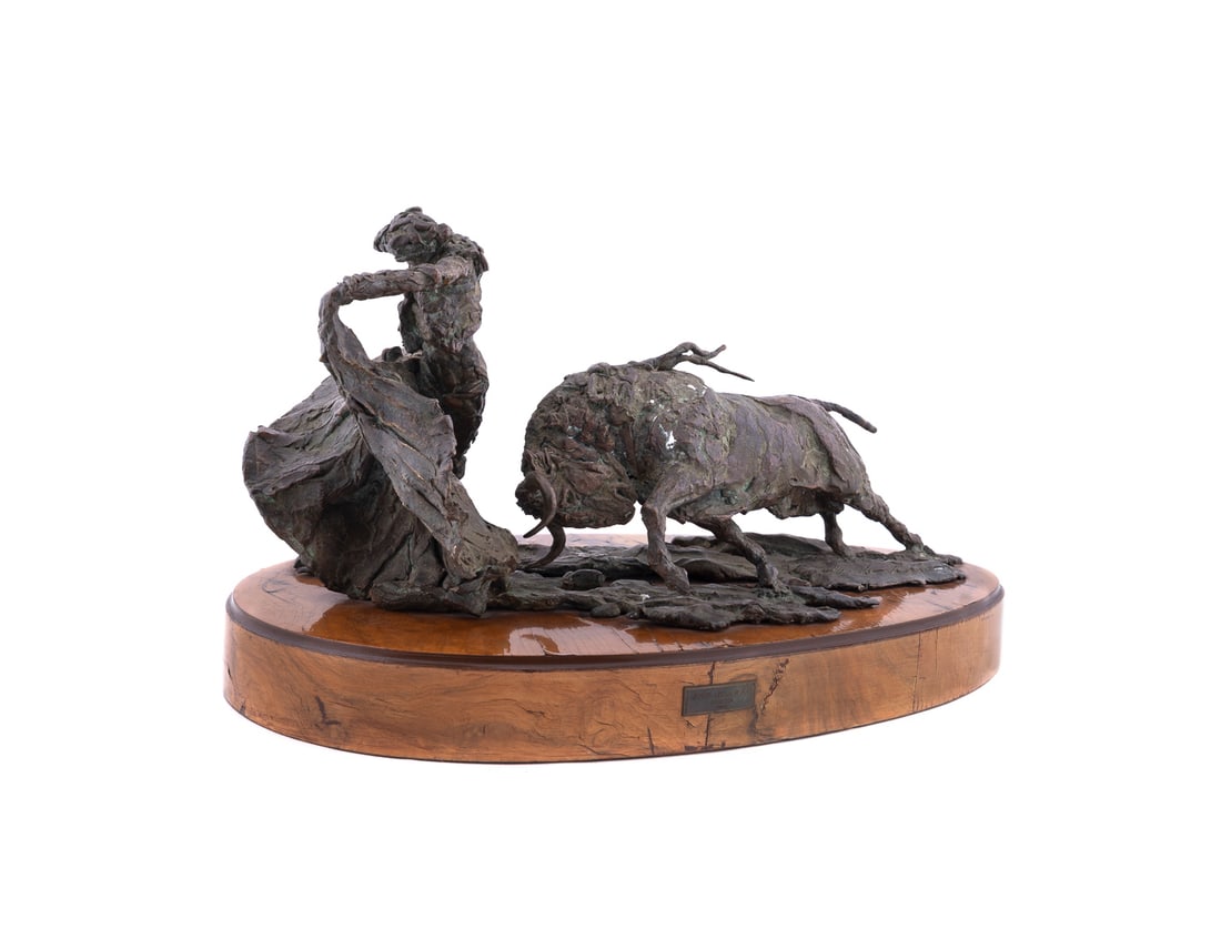 Jorge De La Pena, Bull & Matador, Bronze, 1980: Jorge De La Pena Mexican, born 1953 Untitled - Bull & Matador - 1980 Bronze Signed "de la Pena" in mold to the broze base. On burl veneer base. Overall: 11 x 19 x 10 1/2 in. (27.9 x 48.3 x 26.7 cm.)