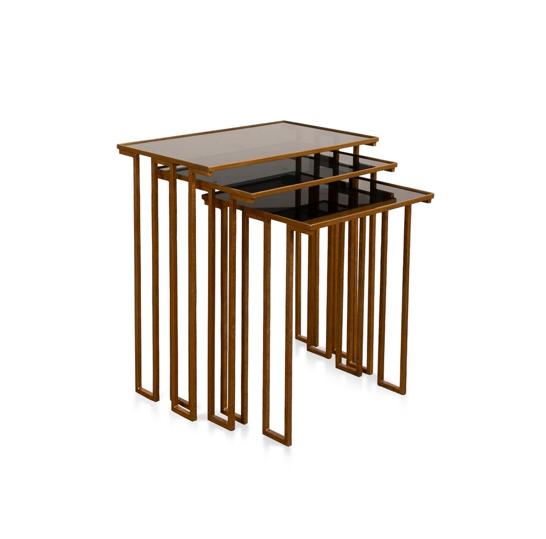 Paul Ferrante "Delphine" Nesting Tables: Paul Ferrante "Delphine" Nesting Tables Paul Ferrante (American, founded 1957), contemporary. Set of three graduated nesting tables, having a gilded finish, and smokey glass tops. Apparently unmarked.