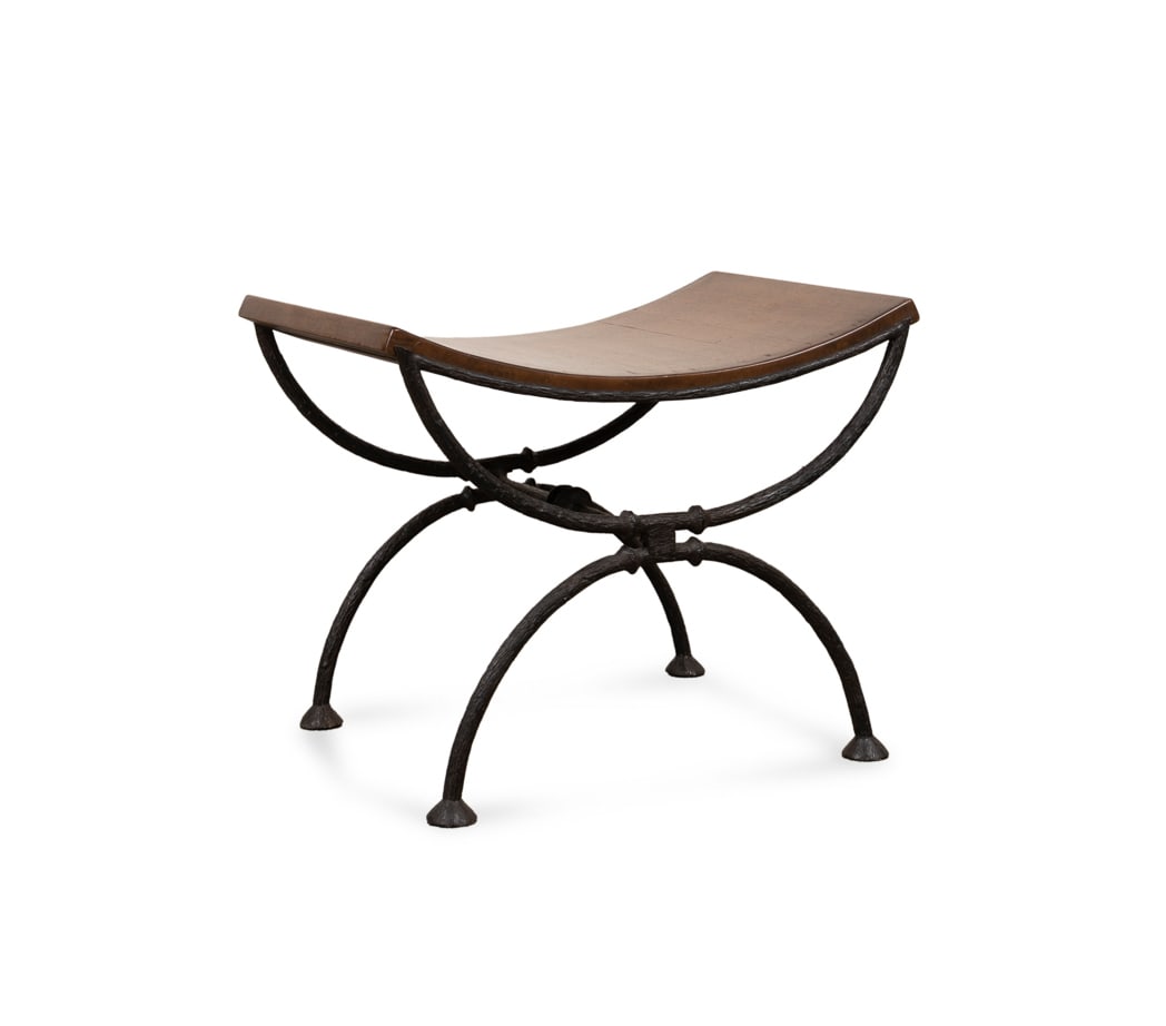 Paul Ferrante "Pompeian" Bench: Paul Ferrante "Pompeian" Bench Paul Ferrante (American, founded 1957), contemporary. Model 6095, having a curved walnut seat on a wrought iron curule base. Apparently unmarked. 26 x 24 x 15 in. (66 x 