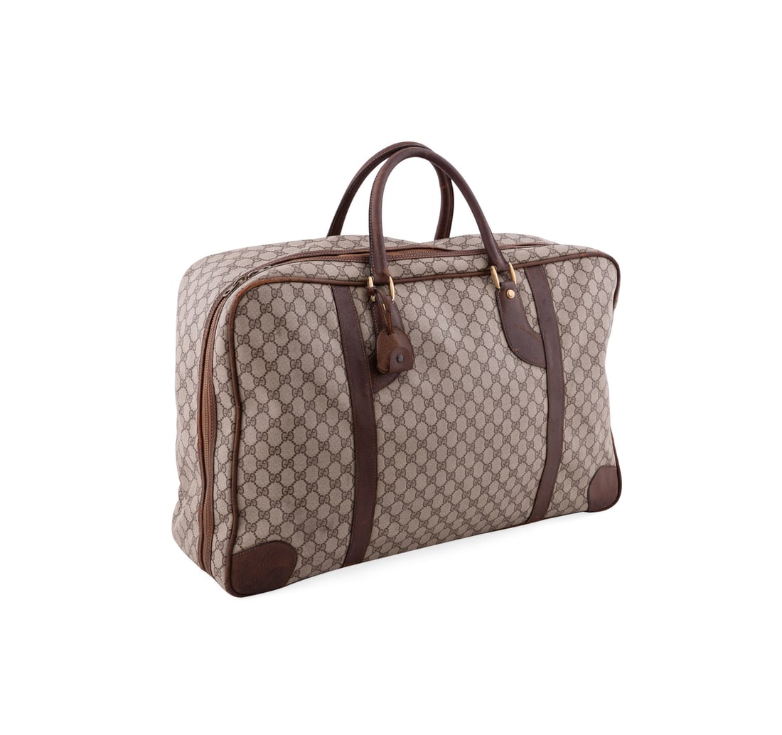Vintage Gucci Softsided Monogram Duffle Suitcase: Vintage Gucci Monogram Canvas Soft Sided Suitcase 1970s - 1980s Gucci (Italian, founded 1921). Made of monogram GG canvas, leather trims and handles, and gold tone hardware. Having a zip around closur