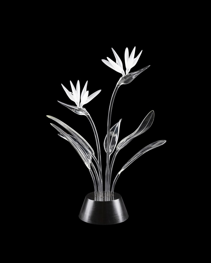 Frabel Birds of Paradise Glass Sculpture: Frabel Birds of Paradise Glass Sculpture Frabel (American, founded 1968). "Birds of Paradise", blown glass sculpture with black painted wooden stand, raised FS monogram signature to back of one leaf. 
