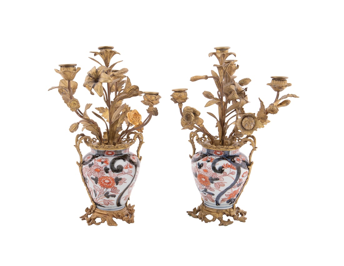 Pair of Bronze Mounted Imari Urn Candelabra: Pair of Bronze Mounted Imari Urn Candelabra The Vases Chinese or Japanese; the Mounts French Each porcelain urn having floral decoration, the 4 light gilt bronze candelabra mounts with mixed flowers i