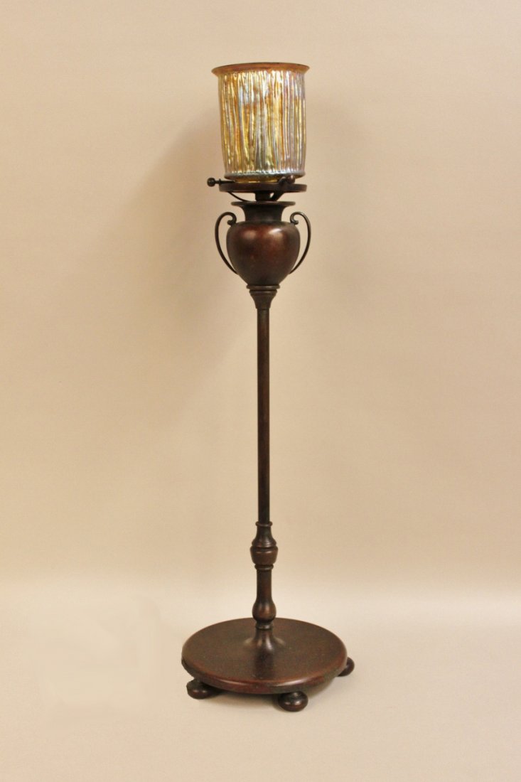 Tiffany Lamp: With bronze base and linen fold art glass shade. Base marked Tiffany Studios, New York, shade marked LCT Favrile. 24 1/2"H. Provenance: A Prominent Atlanta Estate.