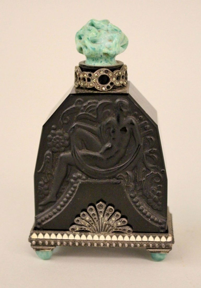 Heinric Hoffman Austrian Black Perfume Bottle: Art Deco design with relief of a seated woman with dragon and flowers. Original stand & collar set with marquesite & enamel, "jade" glass flower form stopper and stand feet. original paper label. 4 3/