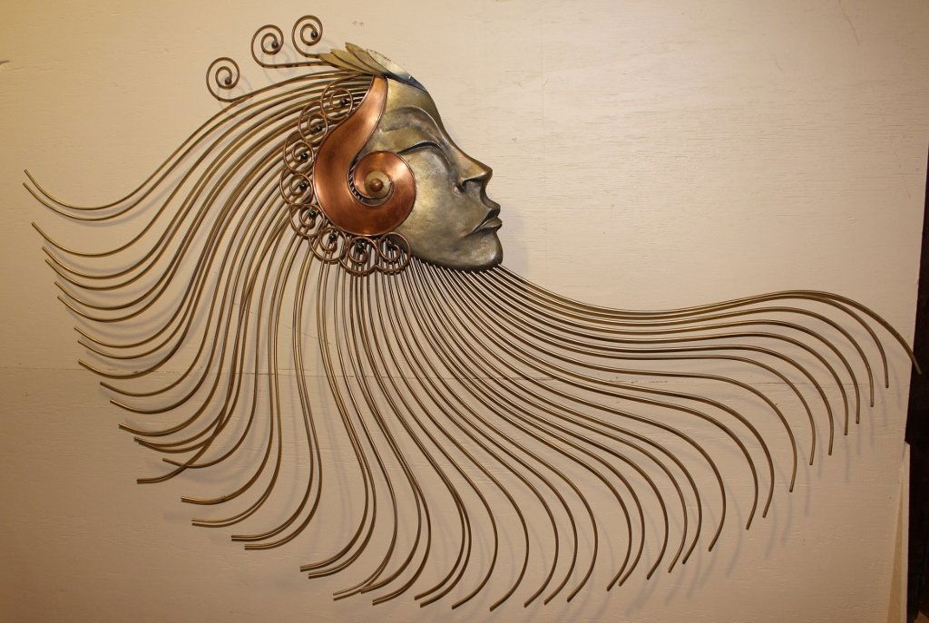 Curtis Jere Wall Sculpture: Of a woman with eyes closed in profile with long hair and stylized spiral design. Provenance: A fine Atlanta Estate.