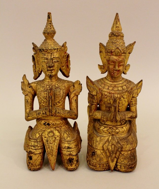 A Pair Wooden Kneeling Thai Figures: Each hand carved and painted gold. Each 9"H.