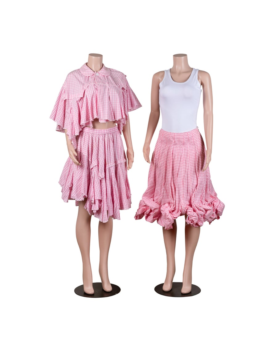Comme des Garcons Pink Gingham Clothing Group: Comme des Garcons (Japanese, founded 1969). Three women's clothing items in pink gingham comprising one cape / shawl with collar, single button closure at neck, multiple ruffles and layers, and no arm
