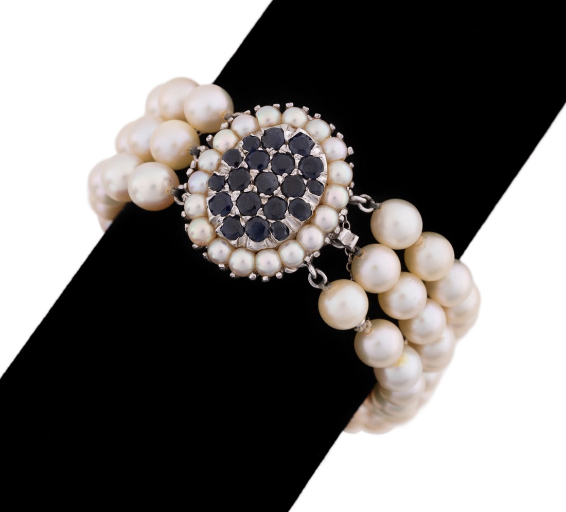 Sapphire & Pearl Bracelet, 14K White Gold Clasp: Bracelet with (72) individually knotted round cultured pearls, each approx. 5.9-6.1mm, and 2 bars; clasp having (19) round sapphires 1.5mm - 3mm, halo with (18) cultured pearls, each approx. 3mm and a
