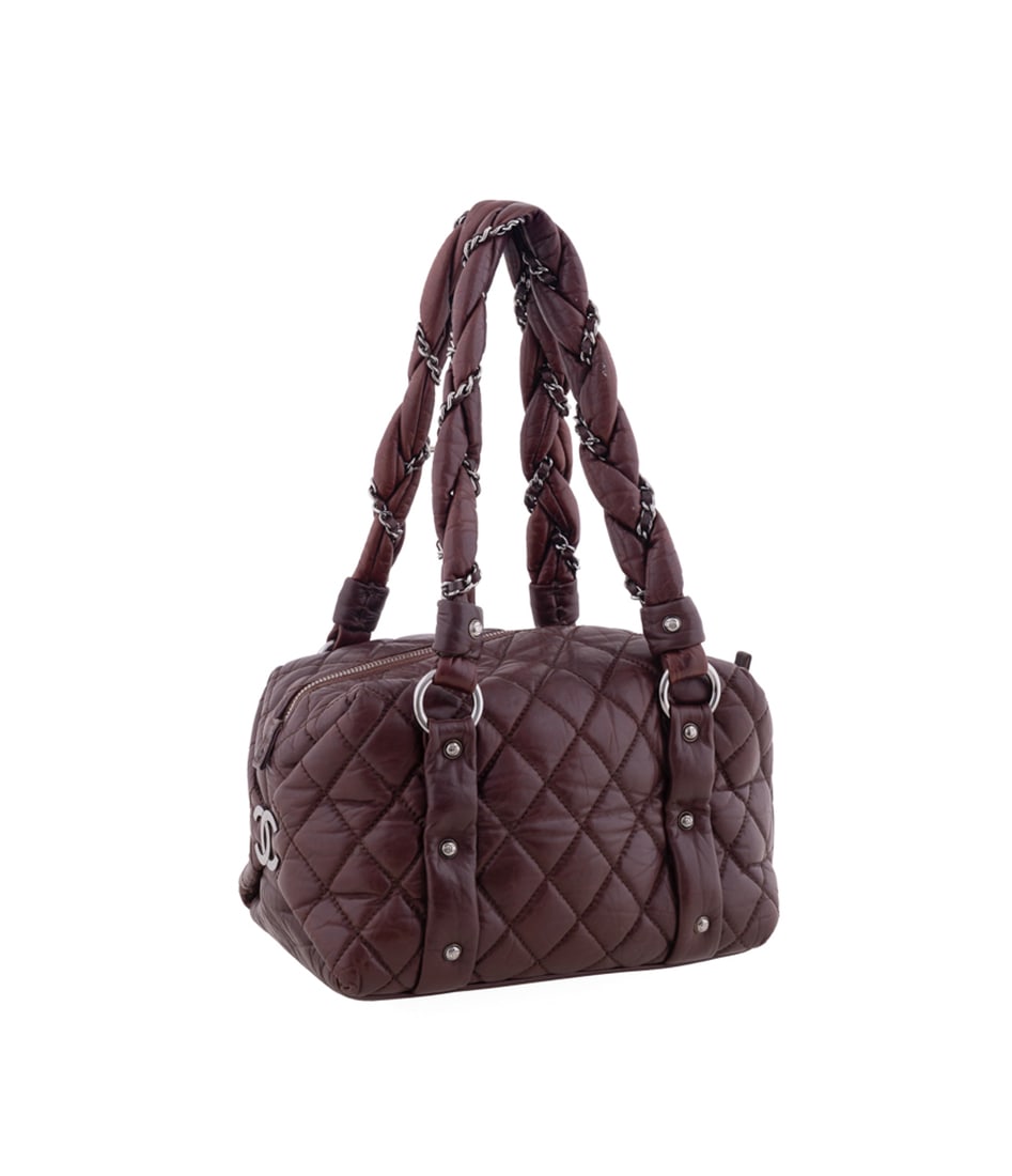Chanel Lady Braid Small Quilted Bowler Bag: Chanel (French, founded 1910), 2005 - 2006. Brownish-red lambskin leather shoulder bag with silver toned hardware, zip top closure, large metal CC logos to both sides, braided leather and chain puffy 