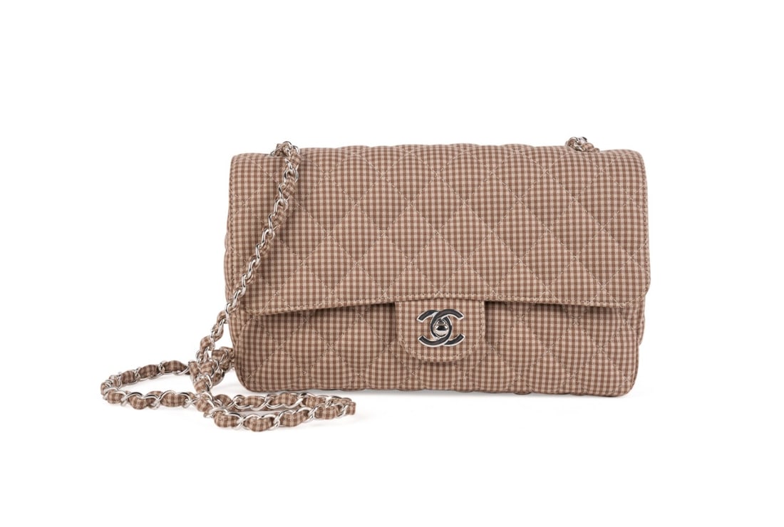Chanel Vintage Gingham Flap Bag, 1996-1997: Chanel (French, founded 1910), 1996-1997. Vintage tan and brown gingham plaid flap bag with silver toned hardware, CC turn lock to front, chain and fabric crossbody strap, leather lining, and exterior