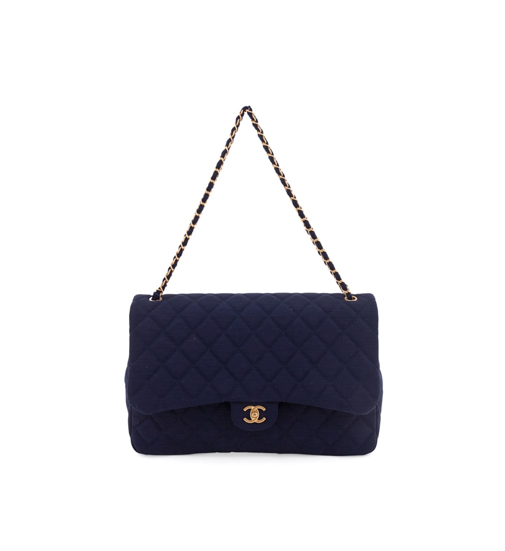 Chanel, Navy Jersey Quilted Maxi Flap Bag: Chanel (French, founded 1910), post-2022. With large front flap, gold toned hardware, CC logo turn lock, chain and fabric adjustable strap, external open pocket, blue fabric interior, one zip pocket, 