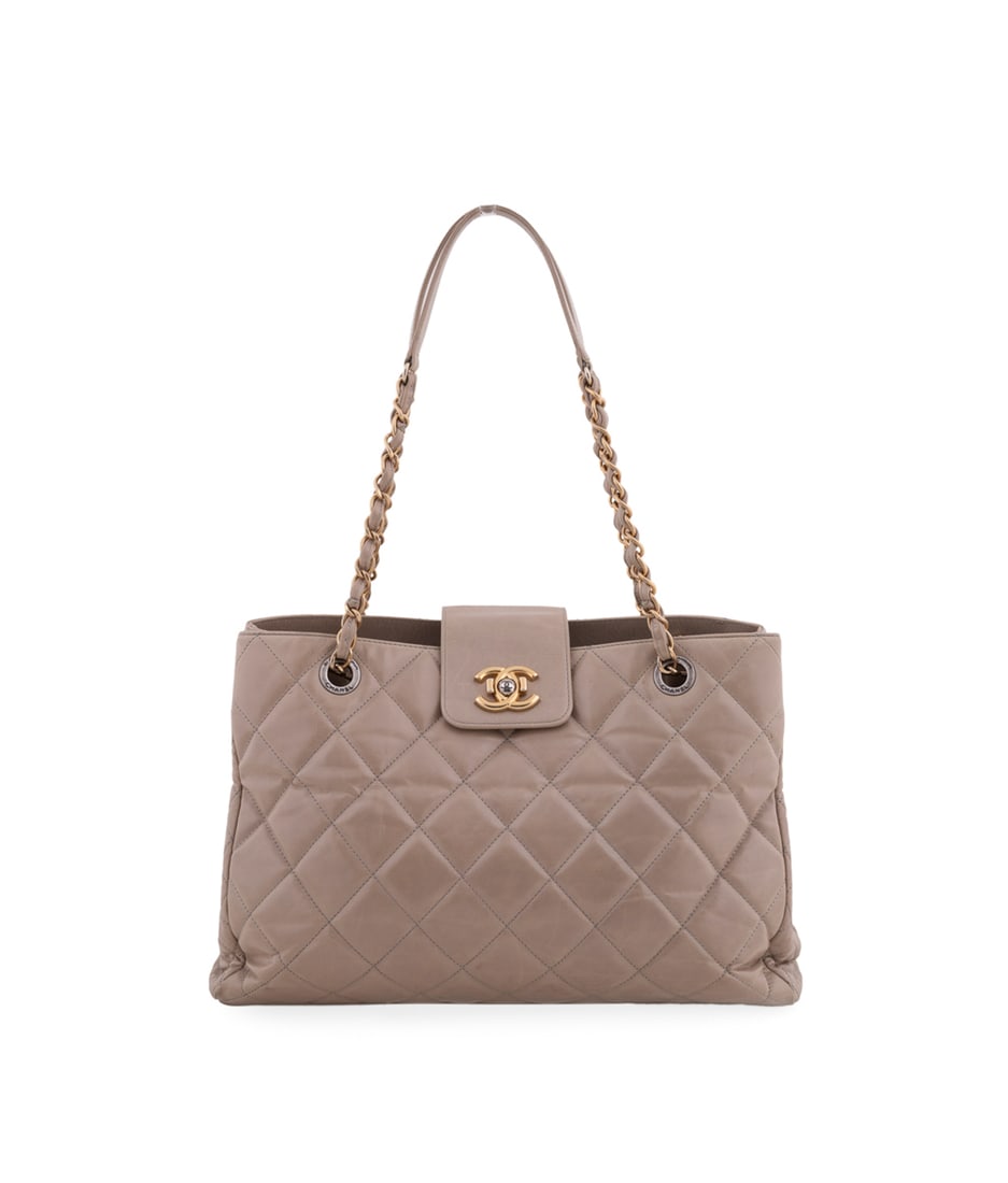 Chanel, Beige Quilted Calfskin Daily Walk Tote: Chanel (French, founded 1910), 2014-2015. With gold toned and gunmetal hardware, leather and chain handles, CC logo push lock closure, interior burgundy fabric lining, a center zip pocket, a sidewall 