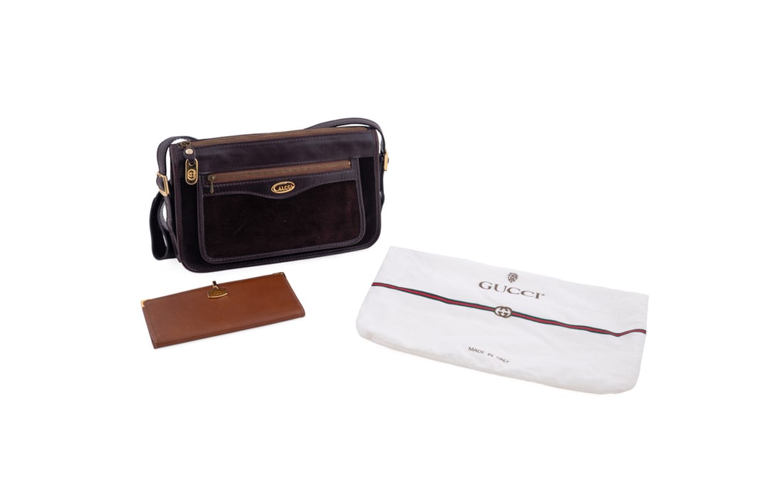 Vintage Gucci Brown Handbag and Wallet Group: Gucci (Italian, founded 1921), 1970s - 1980s. Group of two vintage items comprising one dark brown suede bag with leather trims, long adjustable leather strap, gold tone hardware, front exterior zip p