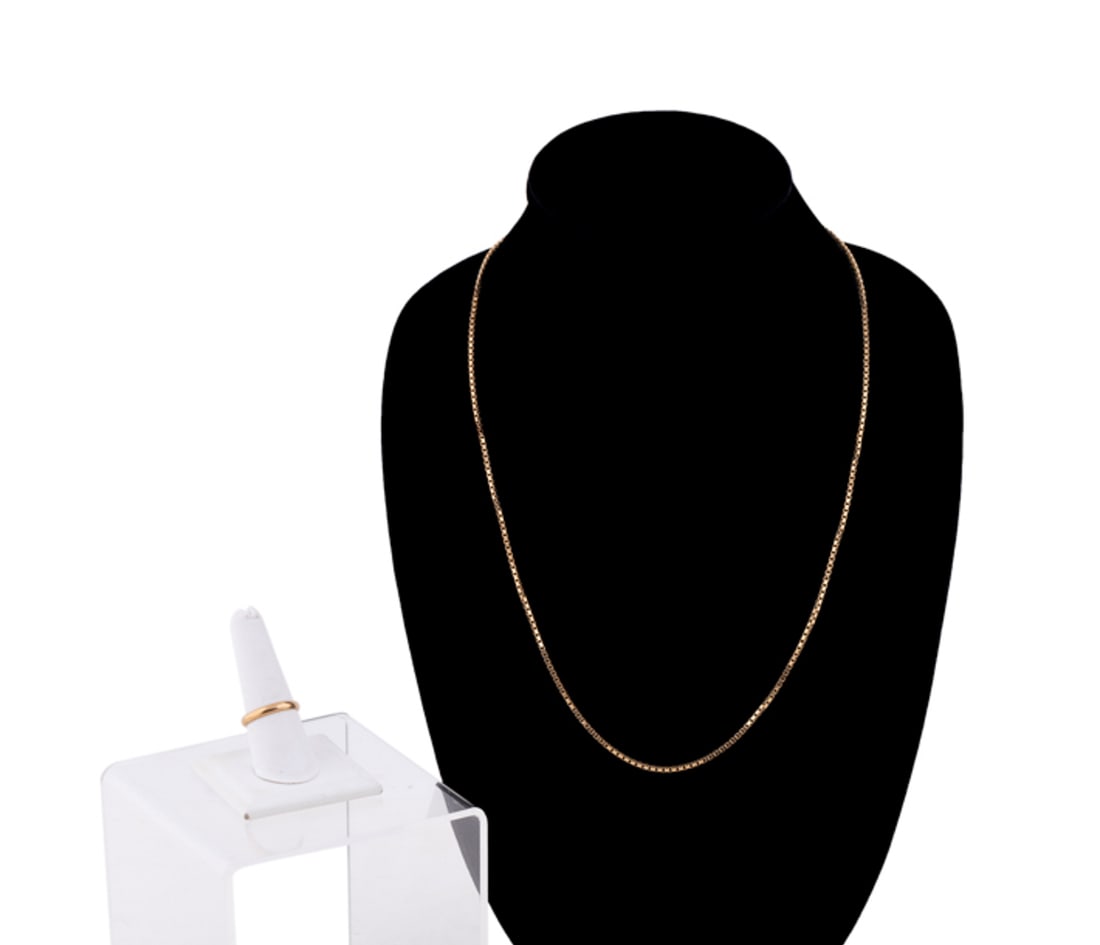 2 Pieces, 14K YG Box Chain & Band Ring: Ring stamped 585P and chain 14k to clasp. Approximate dimensions: Chain l. 24 in US ring size 9, total weight 17.5 grams. Provenance: Private Collection of Davi Sloman, Toronto, ON. Note: Direct credi