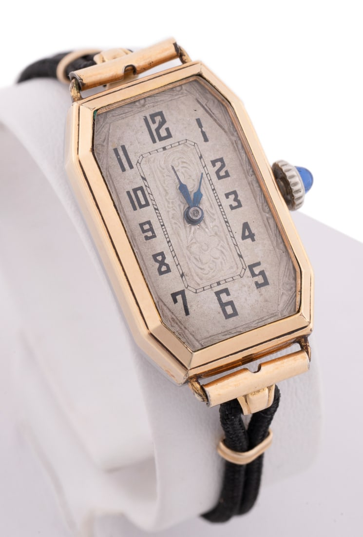 Ladies' 1920s -1930s YG Filled Wrist Watch: Axa Watch Co. (Swiss), 1920s-1930s. Yellow gold filled ladies' wrist watch having a black cord strap with gold plated clasp, featuring 15 jewels manual wind movement, silver tone dial having black hou