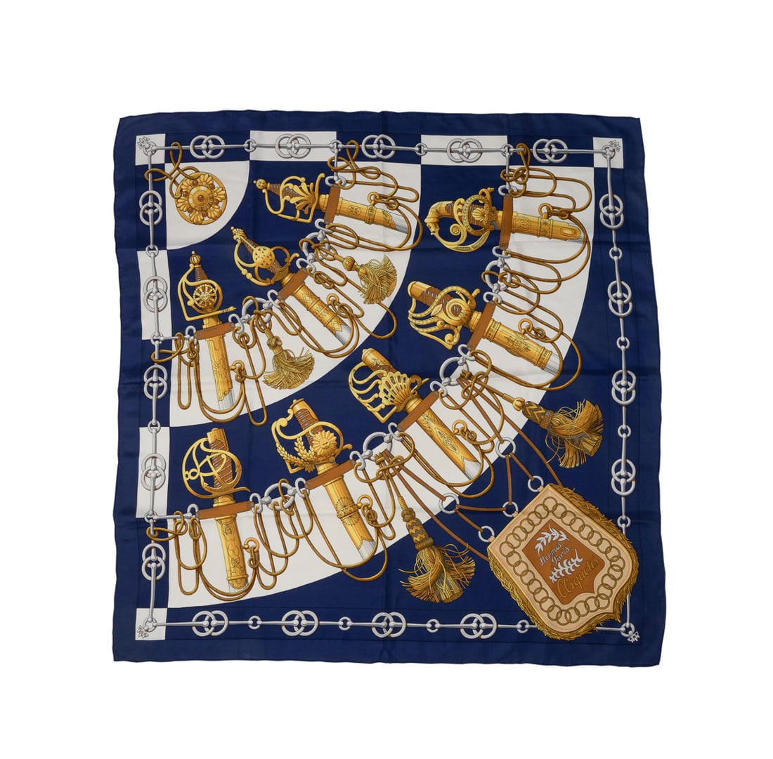 Hermes, "Cliquetis" Silk Scarf: Julia Abadie for Hermes (French, founded 1837). "Cliquetis" silk scarf in navy and gold, originally designed in 1972, appropriately marked, without original care tag. Approximate dimensions: 34 x 35 1