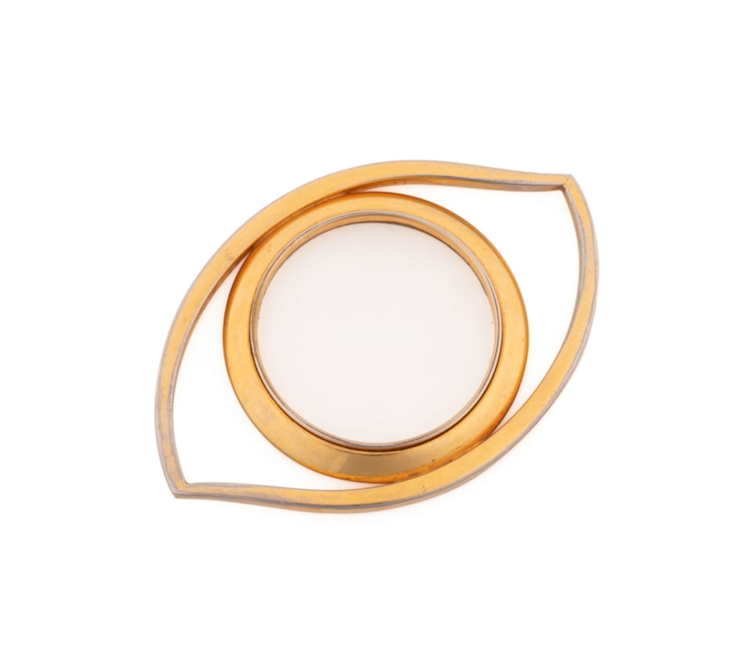 Hermes "Eye of Cleopatra" Magnifying Glass: Jean Cocteau (French, 1889-1963) for Hermes (French, founded 1837), 20th century. Or scarf ring, composed of gold plated metal. Appropriately marked Approximate dimensions: 1/2 x 4 x 2 3/4 in. (1.3 x 