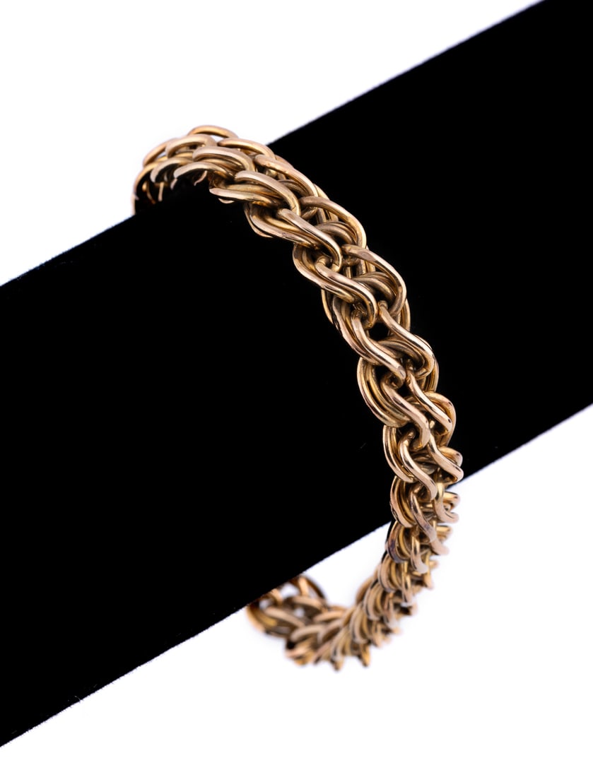 14K Yellow Gold Fancy Link Bracelet: Designed as interlocking openwork links. Engraved 'TH 00/ NAVY'. Approximate dimensions: Length: 6 3/4 in.Width: 10 mm7.35 grams Provenance: Private Collection of Mike Stern, Atlanta, GA. Note: