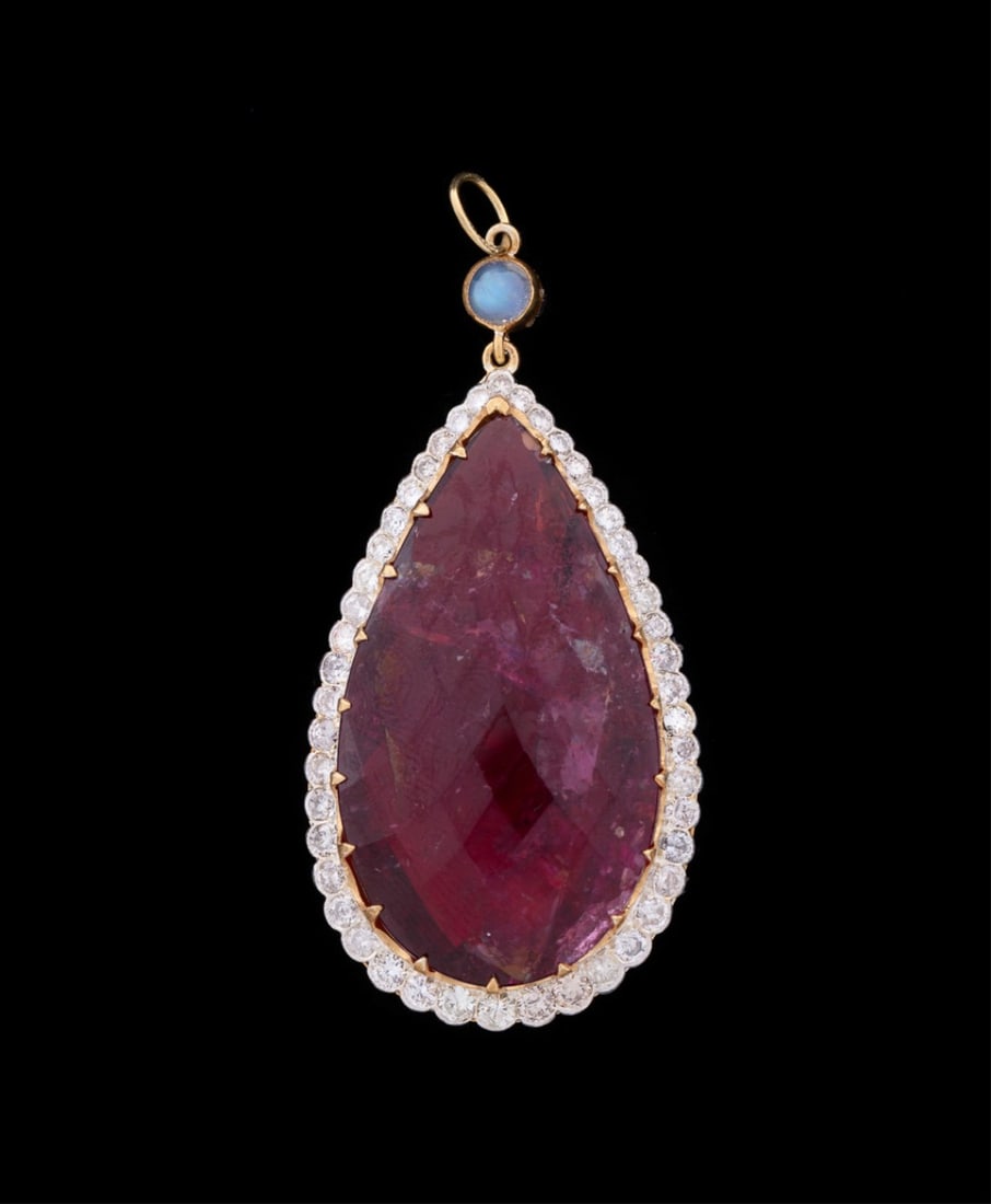 Rubellite, Diamond, & Moonstone Vermeil Pendant: Set with (1) large pear shape natural rubellite weighing approximately 12.55 total carats surrounded by (48) full cut diamonds weighing approximately 2 total carats, topped by (1) round moonstone