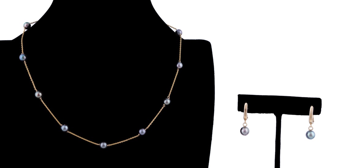 Three Piece Black Pearl Jewelry Set in 14K YG: In 14k yellow gold, comprising a pair of leverbacks with round pearl dangles and link chain with nine round pearls. Both stamped 14k. Approximate dimensions: Necklace: l. 16.5 in Earrings: h. 1 in. Pr