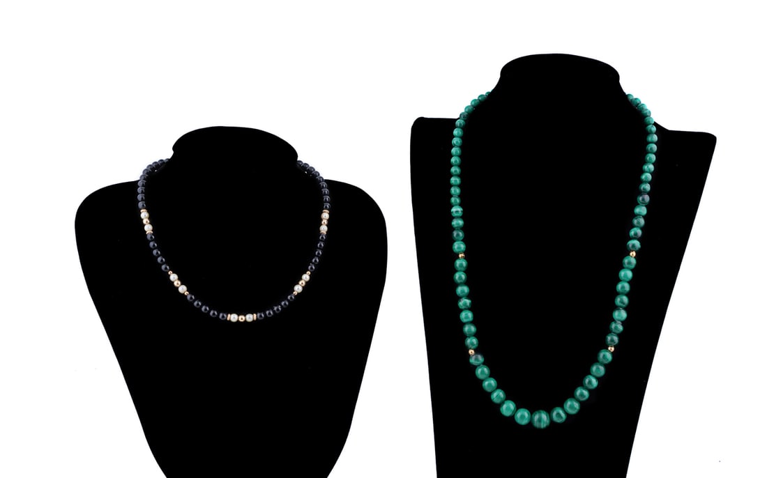 Two YG Accent Bead Necklaces, Malachite & Onyx: Comprising one with round onyx and pearls, having a 14k yellow gold flower clasp, and one with graduated malachite beads and gold plated clasp. Flower stamped 14k to back. Approximate dimensions: Mala