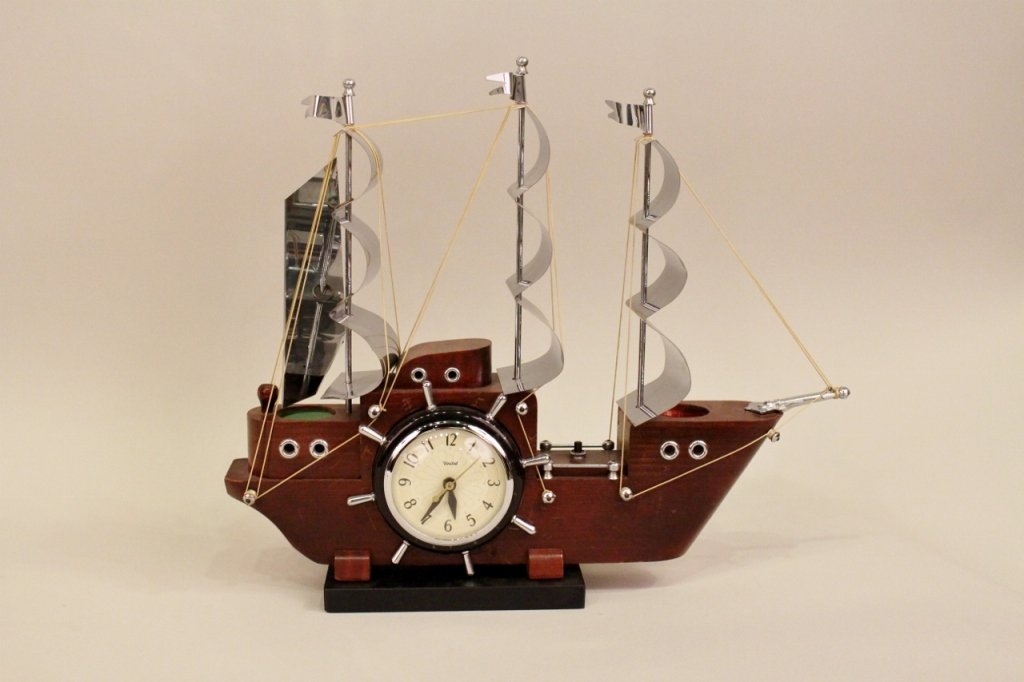 A United Clipper Ship Mantel Clock: Made of Wood and Metal.